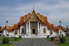 
Wat Benchamabophit, called the Marble Wat because of the white Carrara marble of which it's constructed, is an early-20C temple designed by Prince Narai, the half brother of Rama V. It's the most modern and one of the most beautiful of Bangkok's royal wats. Unlike the older complexes, there's no truly monumental wihaan or chedi dominating the grounds. Many smaller buildings reflect a melding of European materials and designs with traditional Thai religious architecture. Even the courtyards are paved with polished white marble.
